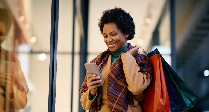 Woman walking with shopping bags