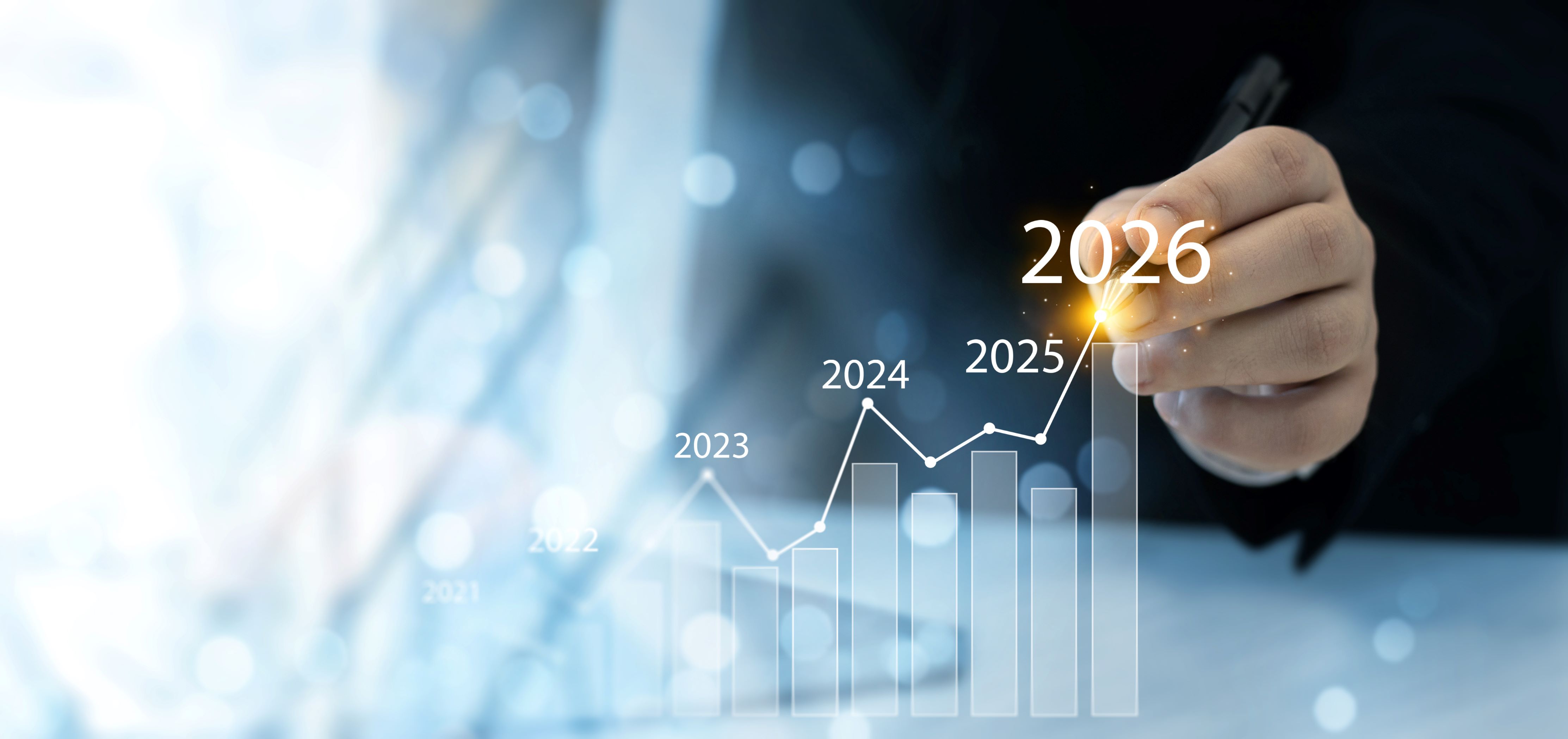 Businessman analyzing financial growth chart for 2026 year.Showing revenue increase, market trends, investment strategy, economic progress, success and future business development in 2026