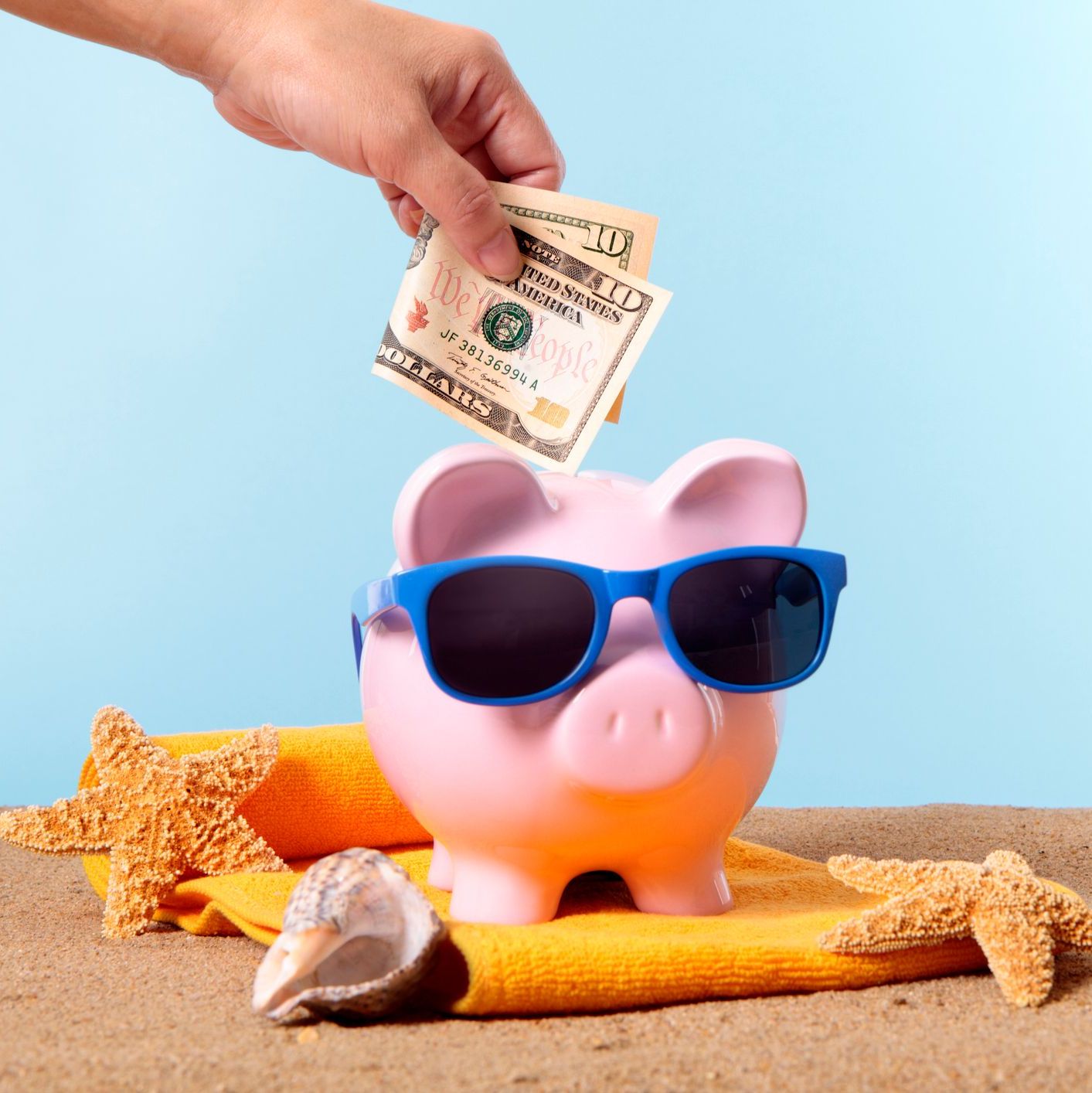 Money being put into a piggy bank