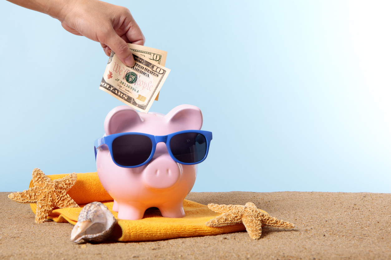 Money being put into a piggy bank