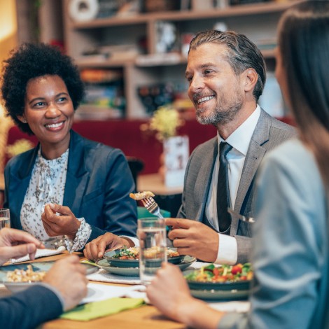 Coworkers eating lunch together