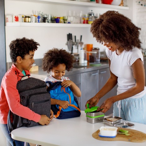 Woman packing her childrens' lunches