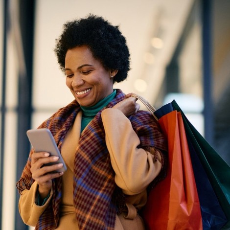 Woman walking with shopping bags