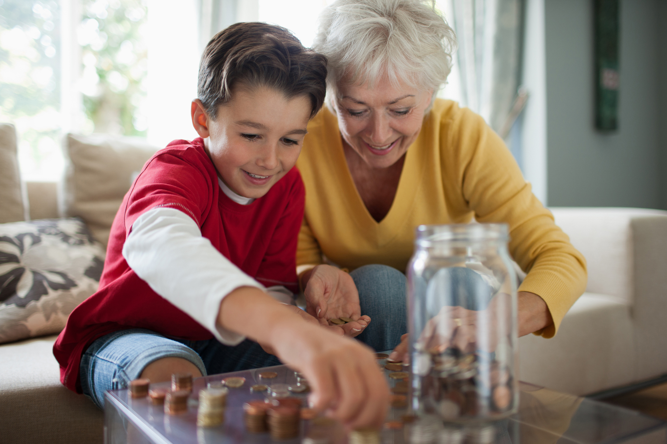 Kid and grandma saving money