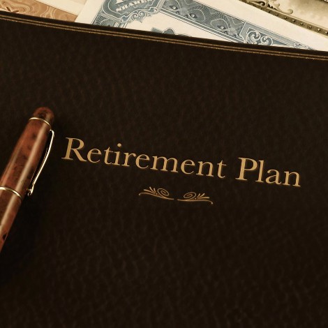Retirement plan book and pen