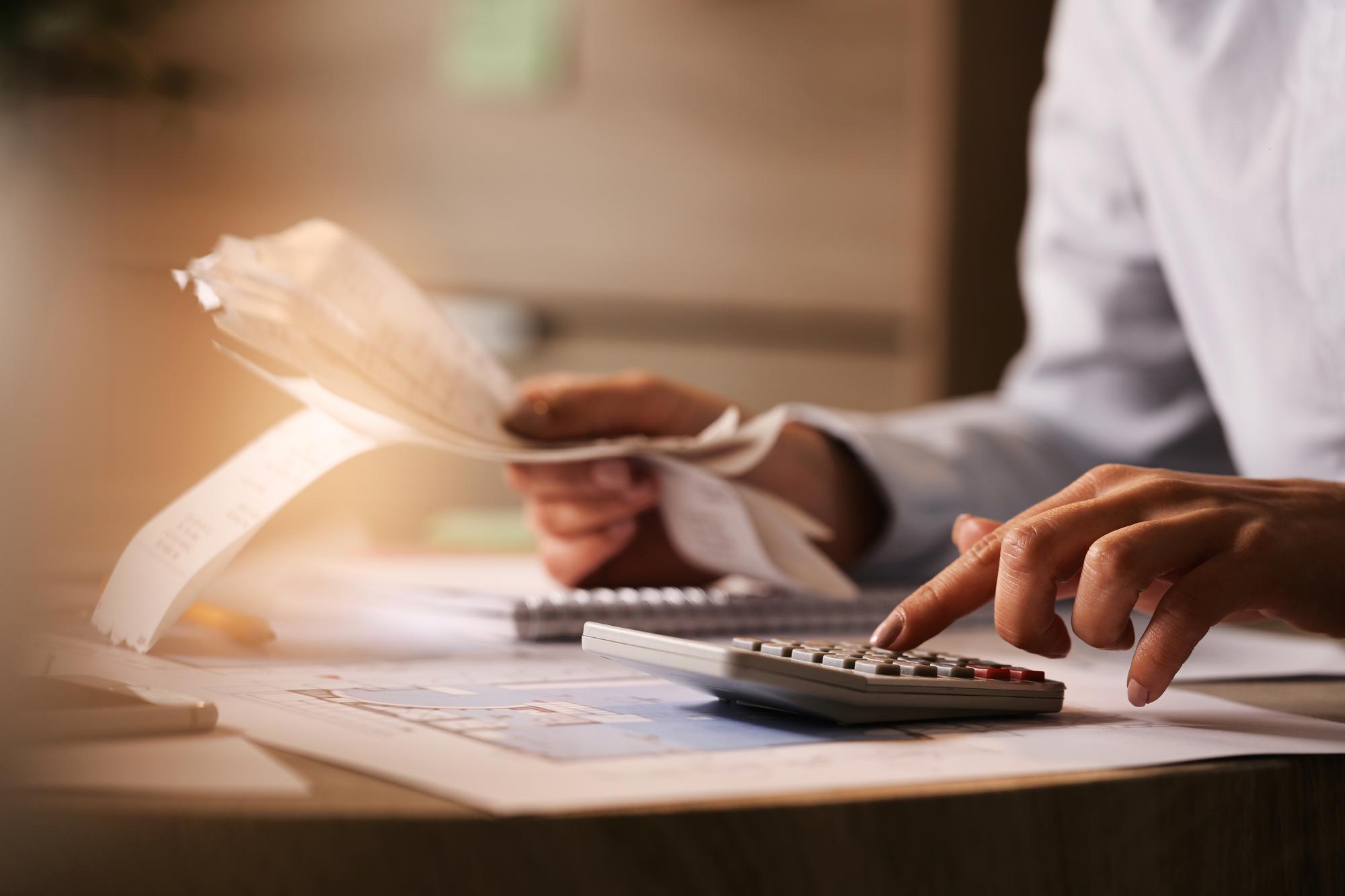 Women working with receipts and calculator