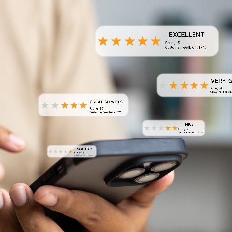 person on phone looking at positive reviews