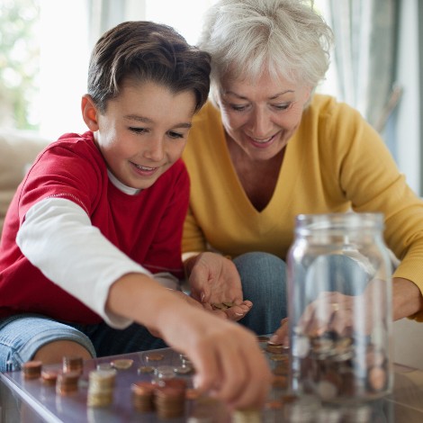 Kid and grandma saving money