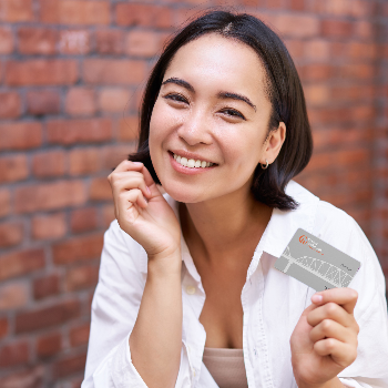 girl holding CW credit card
