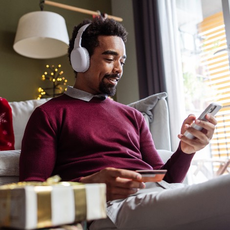 Man on computer buying gifts