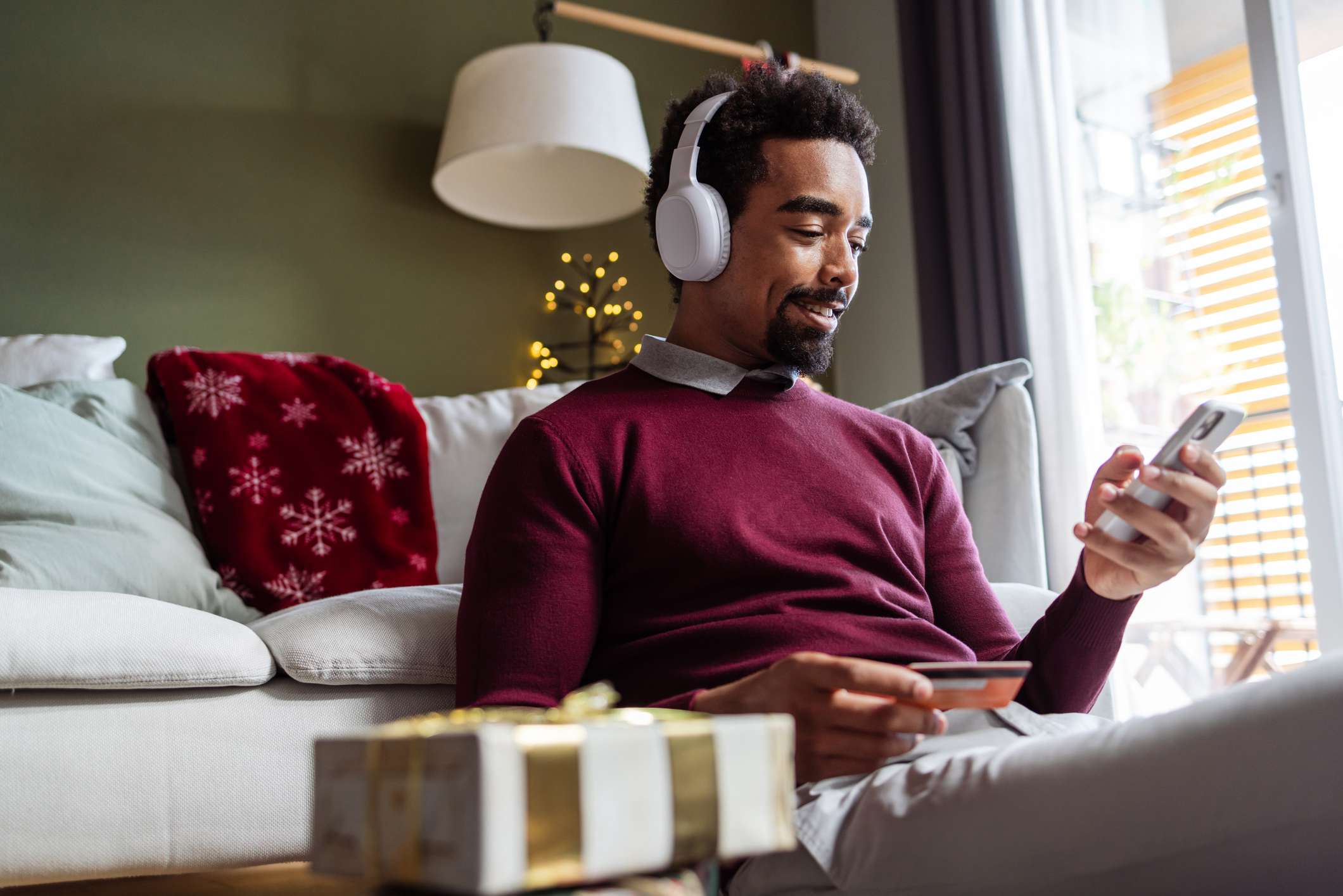 Man on computer buying gifts