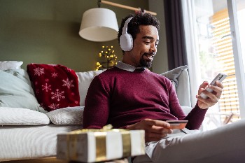 Man on computer buying gifts