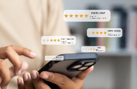 person on phone looking at positive reviews
