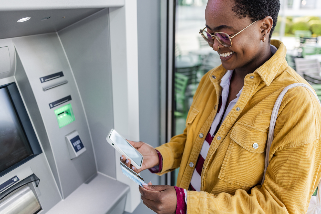A woman using an ATM