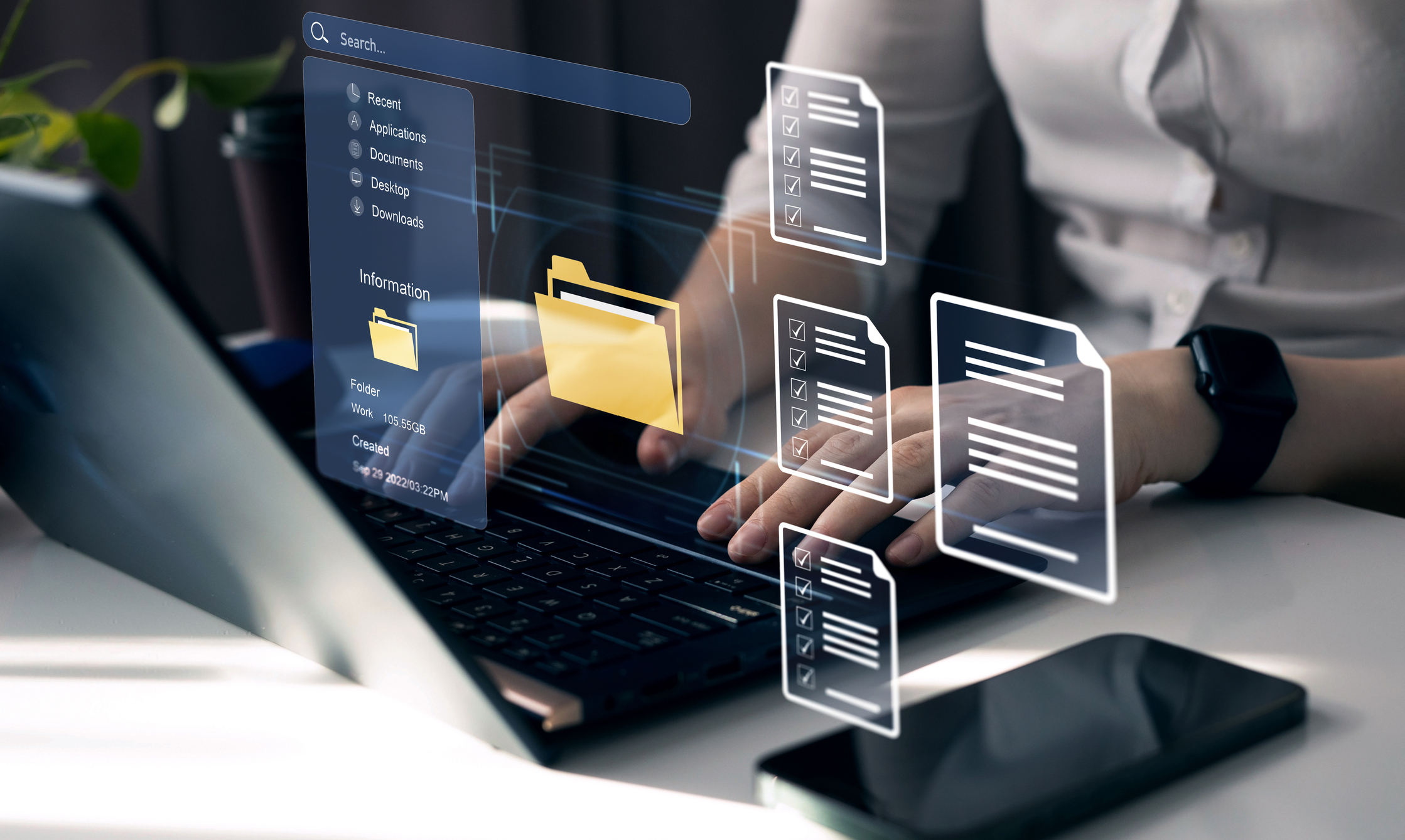 Someone working on laptop with overlay icons of files