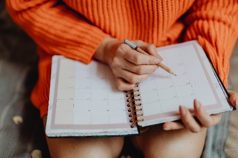 Person looking at calendar on lap