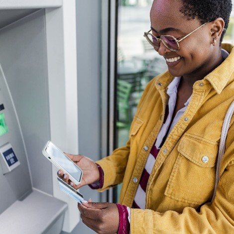 A woman using an ATM