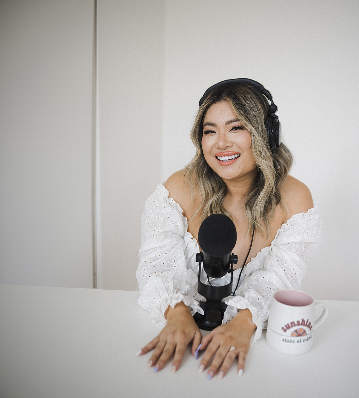 Ellen wearing headphones