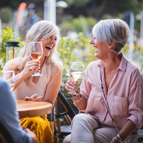 3 ladies enjoying a glass of wine outside